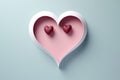 Soft pink heart with a bold red center crafted from paper, representing a tender sentiment against a cool blue backdrop.