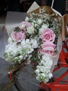 Soft pink roses and white flowers bouquet on red bicycle Royalty Free Stock Photo