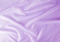 A soft pink satin material background
