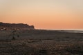 Soft pink sunset over the calm coastline