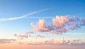 Soft pink and white clouds float in a clear blue sky during sunrise or sunset Keywords: sky, clouds, pink clouds Royalty Free Stock Photo
