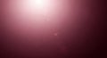 Soft Pinkish Red Gradient Background With Bright Light Source And Lens Flare Effects maroon Royalty Free Stock Photo