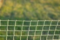 Use of rolled plastic rolls for lawn fencing. Soft focus Royalty Free Stock Photo