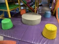 Soft play area with 5 soft multicoloured pillars