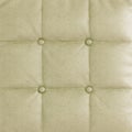 Soft quilted background beige texture panel made of leather. 3d rendering