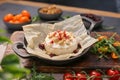 Soft-Ripened Cheese served with tomatoes and other vegetables on the pan Royalty Free Stock Photo