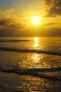 Soft Sea Ocean Waves Wash Over Golden Sand Background. Sunset, Sunrise, Sun. Toned like instant photo Royalty Free Stock Photo