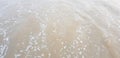 soft sea waves on sandy surface background