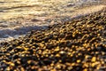 Soft sea waves and sea pebbles nature and abstract  bokeh background. Selective focus Royalty Free Stock Photo