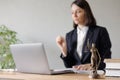 soft selective focus, female lawyer conducts an online consultation from a laptop via video link for a client. work in a