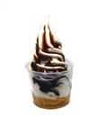 Soft serve ice cream in a cup with topping Royalty Free Stock Photo