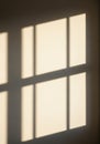 Soft shadows form a grid pattern on a smooth surface, resembling sunlight streaming Royalty Free Stock Photo