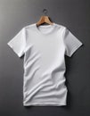Soft and Simple White T Shirt Displayed on a Smooth Gray Surface for Versatility and Comfort Royalty Free Stock Photo