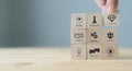 Soft skills concept. Used for presentation, banner. Hand puts wooden cubes with icons of `SOFT SKILLS` ; creativity, EQ, Problem