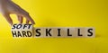 Soft Skills and Hard Skills symbol. Hand turns a cube and changes the words Soft Skills to Hard Skills. Beautiful yellow Royalty Free Stock Photo
