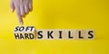 Soft Skills and Hard Skills symbol. Hand turns a cube and changes the words Soft Skills to Hard Skills. Beautiful yellow Royalty Free Stock Photo