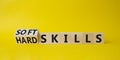 Soft Skills and Hard Skills symbol. Turned cubes with words Soft Skills and Hard Skills. Beautiful yellow background. Businessman Royalty Free Stock Photo