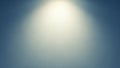 Soft Spotlight Illuminating a Textured Blue Gray Gradient Background with Subtle Grain and Light Vignette Effect Royalty Free Stock Photo