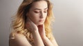 Soft studio portrait of a beautiful woman, girl face with curly hair disheveled from wind , the concept of natural beauty, Royalty Free Stock Photo