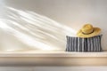 A cozy indoor setting with a straw hat resting on a striped pillow by natural light Royalty Free Stock Photo