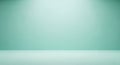 Soft Teal Studio Background with Subtle Lighting and Floor Transition Keywords: studio Royalty Free Stock Photo