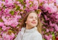 Soft and tender. Pink is on my mind. Pink is my favorite. Little girl enjoy spring. Kid pink flowers of sakura tree Royalty Free Stock Photo