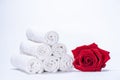 Soft terry towels, rose petals for skin care and spa on a white background Royalty Free Stock Photo