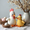 Soft textile chicken and chick figures adorn an Easter table setting with decorated eggs and pussy willow branches. Festive Royalty Free Stock Photo