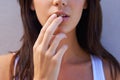 Soft to the touch. Closeup shot of a young woman touching her lips. Royalty Free Stock Photo