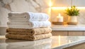 Soft towels arranged on marble surface with diffused lighting Royalty Free Stock Photo