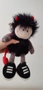 Soft toy designed as boy devil on white background Royalty Free Stock Photo