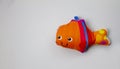 soft toy in the form of a funny fish on a gray background Royalty Free Stock Photo