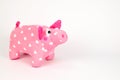 A soft toy in the form of a pink pig covered with white hearts, isolated on a white background Royalty Free Stock Photo