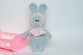 Soft toy knitted bunny. Plush crocheted bunny