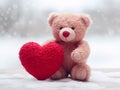 A soft toy pink fluffy bear holding a red heart