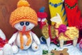 Soft toy snowman in an orange hat and scarf Royalty Free Stock Photo