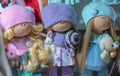 Soft toys dolls in bright knitted things
