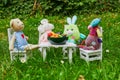 Soft toys having a dinner with clay figurines of fruits and vegetables Royalty Free Stock Photo