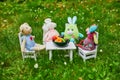 Soft toys having a dinner with clay figurines of fruits and vegetables Royalty Free Stock Photo
