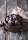 Soft vegan steamed chocolate gingerbread cookies with icing sugar in vintage bowl on wooden table Royalty Free Stock Photo