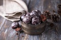 Soft vegan steamed chocolate gingerbread cookies with icing sugar in vintage bowl on wooden table Royalty Free Stock Photo