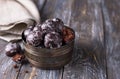 Soft vegan steamed chocolate gingerbread cookies with icing sugar in vintage bowl on wooden table Royalty Free Stock Photo