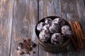 Soft vegan steamed chocolate gingerbread cookies with icing sugar in vintage bowl on wooden table Royalty Free Stock Photo