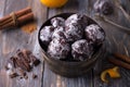 Soft vegan steamed chocolate gingerbread cookies with icing sugar in vintage bowl on wooden table Royalty Free Stock Photo