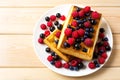 Soft waffle with fresh blueberry and raspberry top view Royalty Free Stock Photo