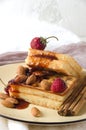 Soft waffles almonds strawberries yellow round plate Royalty Free Stock Photo