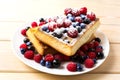 Soft waffles with blueberry and raspberry Royalty Free Stock Photo