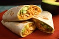 soft and warm tortilla, filled with spicy chicken and creamy avocado