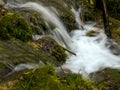 Soft waters running on rocks. Close-up of running water as a picture background Royalty Free Stock Photo