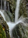 Soft waters running on rocks. Close-up of running water as a picture background Royalty Free Stock Photo